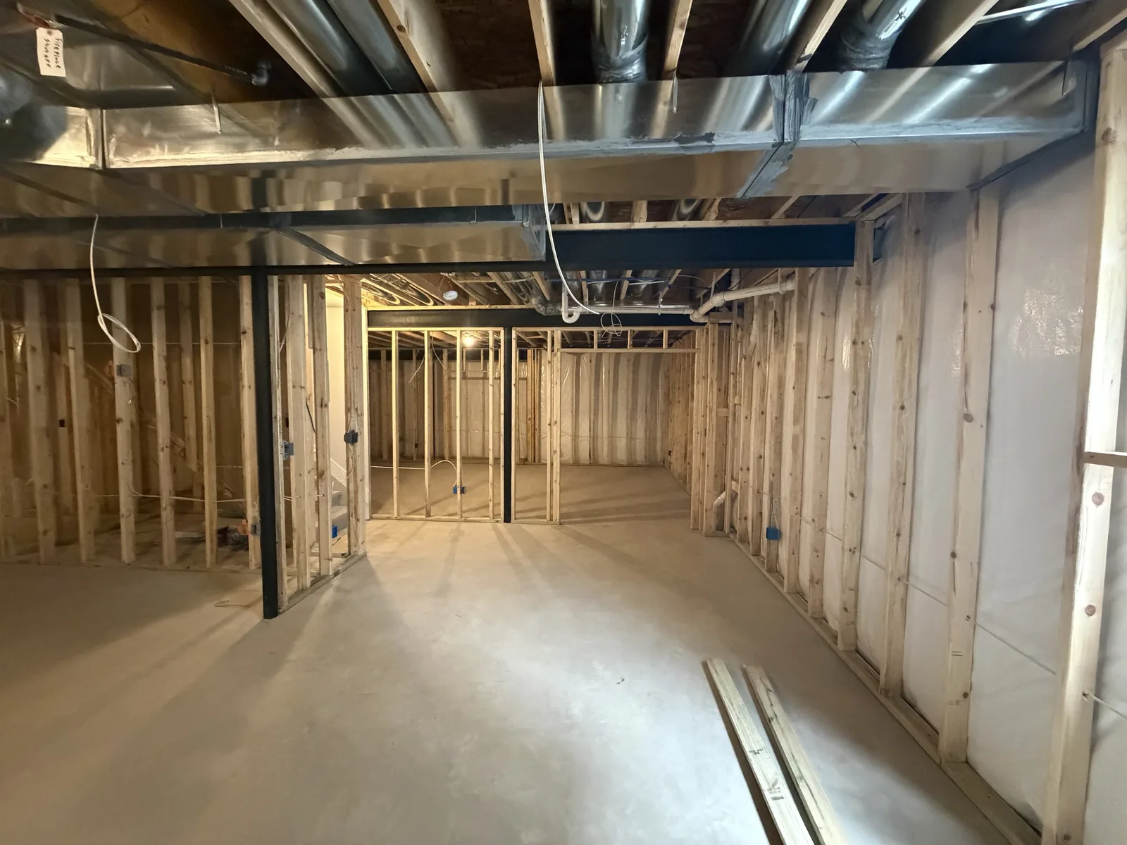Basement partition walls and door openings framed under the main beam, Troy MI