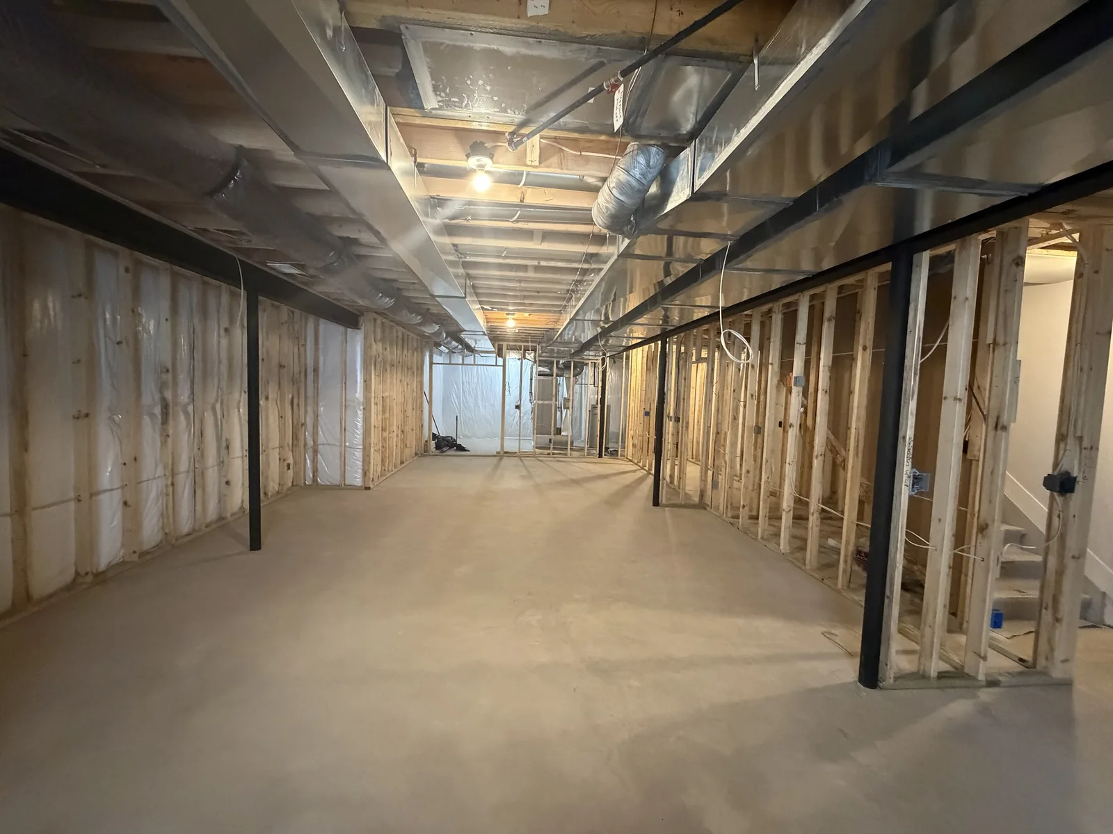 Long view of framed basement perimeter walls and stair enclosure, Troy MI