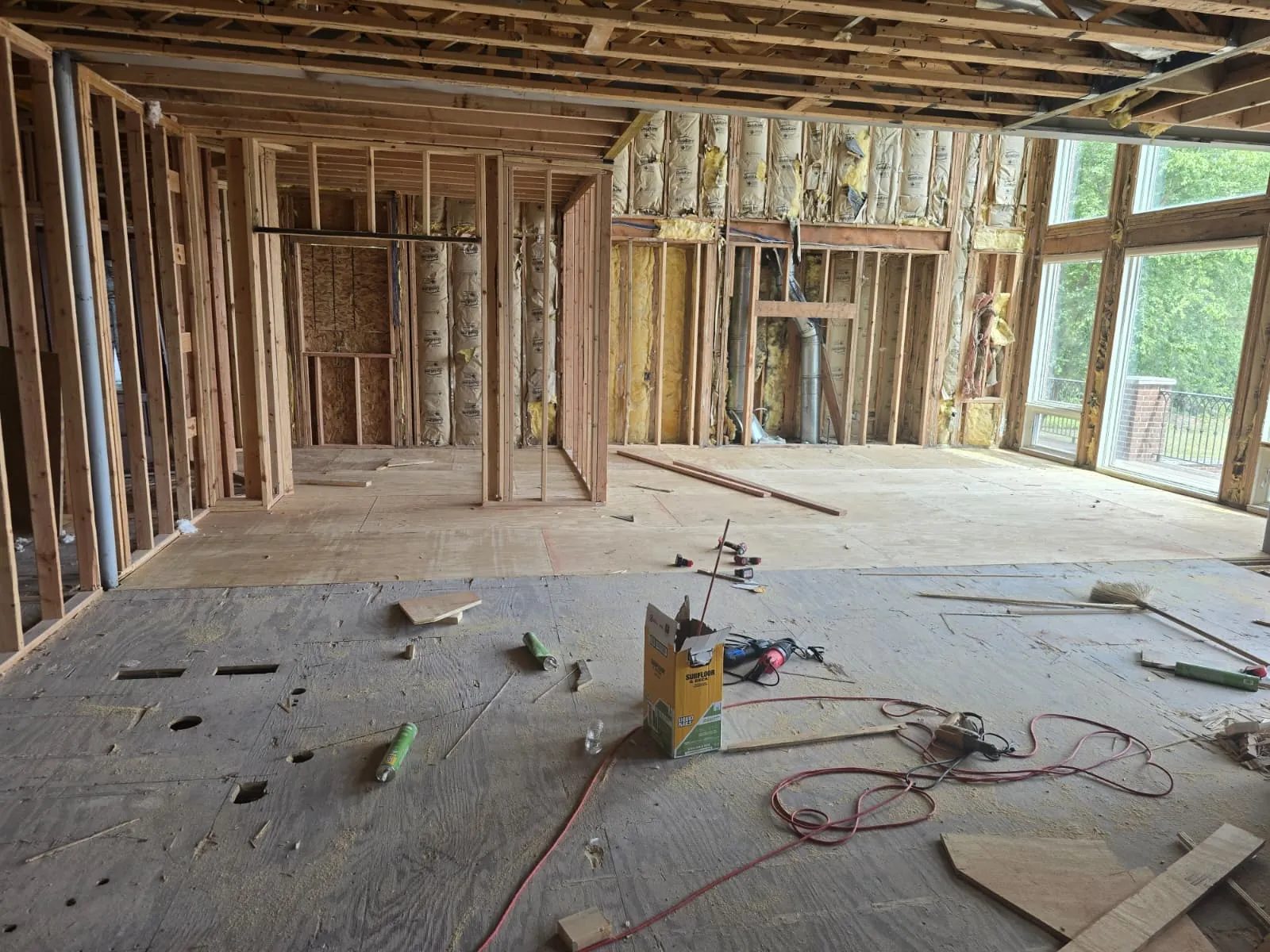 Interior wall framing with window openings in a new home, straight and plumb