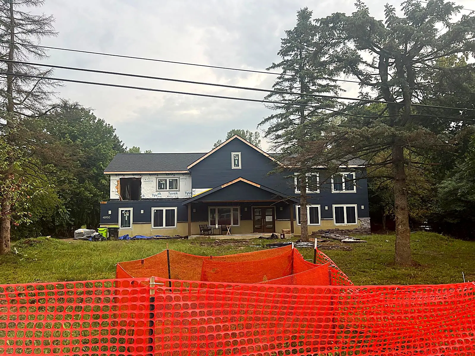 Finished two story home with dark blue siding, Novi MI